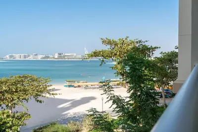 a view of a beach from a building at Welcoming 1 Bedroom Palm Jumeirah with sea View in Dubai
