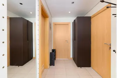 a hallway with black and brown doors in a building at Welcoming 1 Bedroom Palm Jumeirah with sea View in Dubai