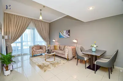 a living room with a couch and a table at Luxury Escapes - 1BR Home with Stunning Marina View - Bay Central Marina in Dubai