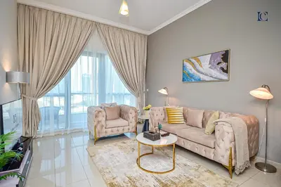 a living room with a couch and two chairs at Luxury Escapes - 1BR Home with Stunning Marina View - Bay Central Marina in Dubai