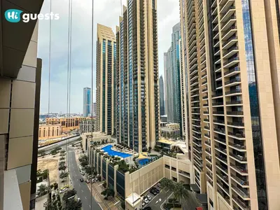 an aerial view of a city with tall buildings at HiGuests - Royal 2BR Apt with Maid's Room Near Burj Khalifa in Dubai