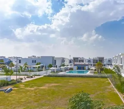an image of an apartment complex with a yard at Upgraded spacious 3BR+Maid Villa in Dubai