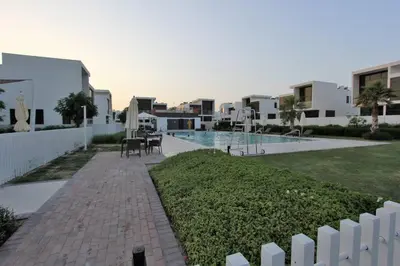 a view of a resort with a swimming pool at Upgraded spacious 3BR+Maid Villa in Dubai
