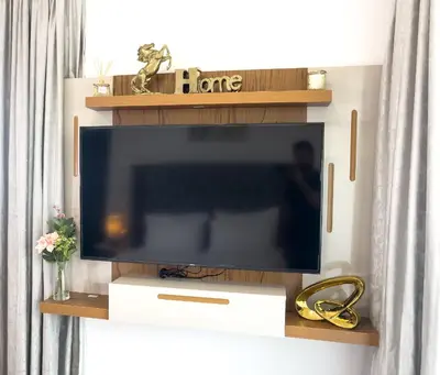 a flat screen tv sitting on a shelf in a living room at Luxury Room with Marina view close to JBR Beach and Metro with Shared Kitchen in Dubai