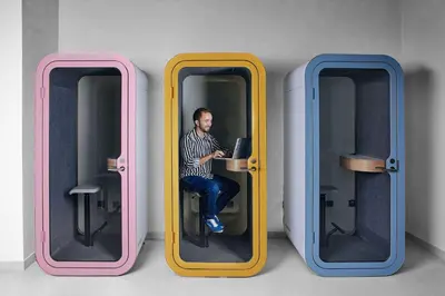 a man sitting in a seat inside a train at Rove Expo City in Dubai