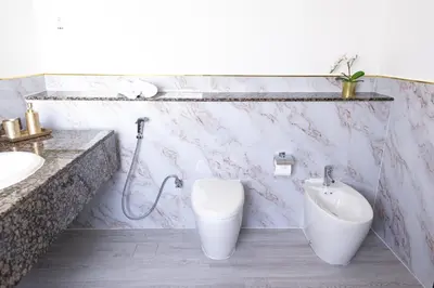 a bathroom with a toilet and a sink at Apartments on JBR by HAPPY SEASON in Dubai