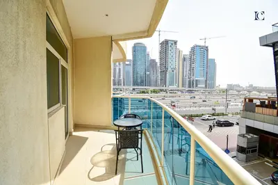 a balcony of a building with a view of a city at Luxury Escapes - Budget Studio with Balcony, Yacht Bay Marina in Dubai