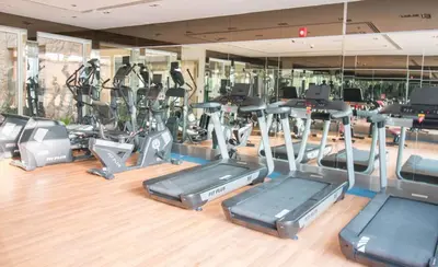a gym with a bunch of cardio equipment in it at Fully Furnished Studio, Ready to Move-in! Resortz 19 in Dubai