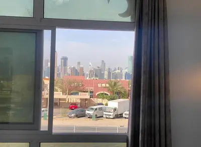a view of a city skyline from a window at Special Offer Studio for Rent in Dubai in Dubai