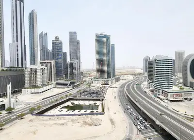 a city with a highway in front of tall buildings at RH- Urban Living, Studio near Dubai Mall, Downtown in Dubai