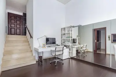 an office with a desk with a computer and chairs at Frank Porter - Marina Promenade in Dubai