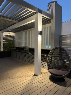 a patio with a chair under a pergola at PROMO I Sea view I 1 BR apartment I Studio One Tower I Dubai Marina in Dubai