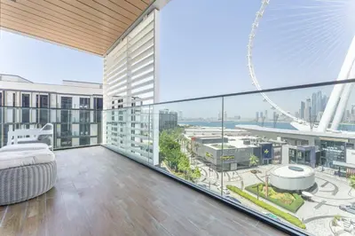 an apartment balcony with a view of the city at Most beautiful 3 BR apt in BLUEWATERS ISLAND, DUBAI in Dubai