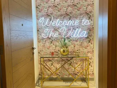 a welcome to the wild sign on a wall next to a door at Modern Dubai Hills Luxury 4 BEDROOM VILLA in Dubai