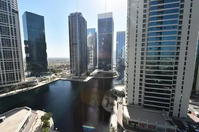 a view of a city with tall buildings and a river at Luxury Escapes - Studio in JLT X1 Tower close to Metro in Dubai