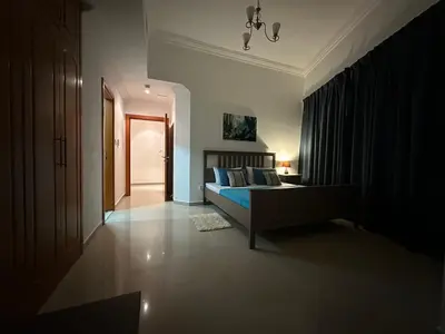 a bedroom with a bed and a hallway at 2 BR apartment with a beautiful view of the Marina minimum 5 night in Dubai