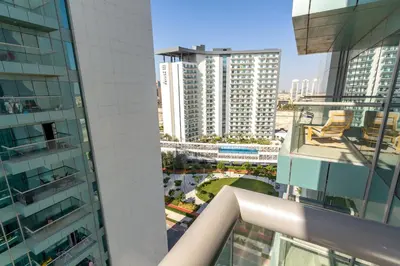 a view of the city from the balcony of a building at Deluxe One Bedroom Apartment for rent in Dubai Al Barsha south in Dubai