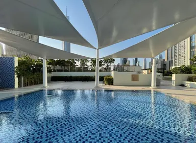 a swimming pool on the roof of a building at GuestReady - The Ivory Coast Downtown Views in Dubai