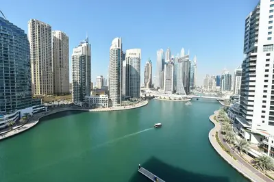 a view of a city with a river and buildings at Luxury Escapes - 1BR with Balcony & Stunning Marina View - MVT in Dubai