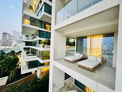 two views of a building with a balcony at FIVE Palm Jumeirah - 2 Bedrooms & Maid Room Apartment in a Splendid Resort in Dubai