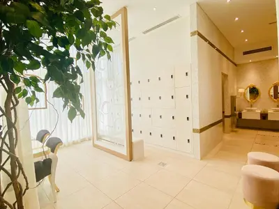 a dressing room with a mirror and a plant at DH58 - High end 1BR, Palm views in Damac Heights tower in Dubai