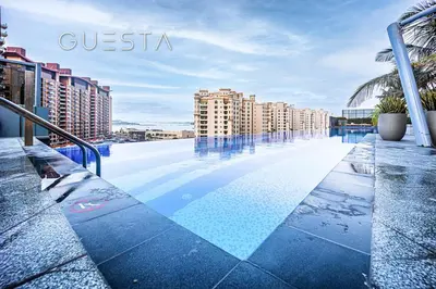 a swimming pool on the roof of a building at The Palm Tower, Nakheel Mall, Palm Jumeirah in Dubai