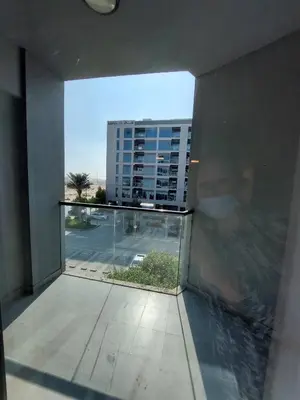 a room with a view of a building from a window at Budget-friendly 2bd near EXPO with a huge pool in Dubai