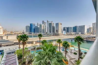 a view of a city with palm trees and buildings at Luxury Aparthotel Prive in Dubai
