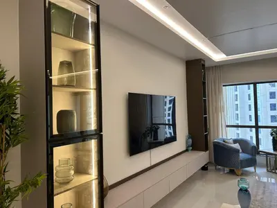 a living room with a tv on a wall at USMANS 4BDRM JBR Sadaf Next to Ritz Carlton Walk Daily Housekeeping JBR in Dubai