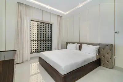 a bedroom with a bed and a large window at USMANS 4BDRM JBR Sadaf Next to Ritz Carlton Walk Daily Housekeeping JBR in Dubai