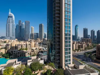 a view of a city skyline with tall buildings at Walk to Burj Khalifa from this 2BR with Skyline Balcony View in Dubai