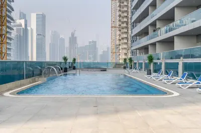 a swimming pool on the roof of a building at GuestReady Holiday Homes - On The Rocks in Dubai