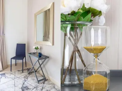 a vase filled with gold next to a table with a chair at Frank Porter - Mon Reve in Dubai