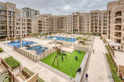 an aerial view of an apartment complex with a pool at Exquisite 2BR at Zahra Breeze Dubailand by Deluxe Holiday Homes in Dubai