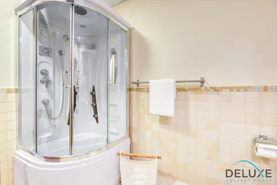 a bathroom with a shower and a toilet at High-floor 1BR Unit Close to Beach with Sea Views, Sadaf 6, Jumeirah Beach Residence by Deluxe Holiday Homes in Dubai