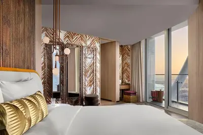 a bedroom with a large bed and a large window at W Dubai - Mina Seyahi in Dubai