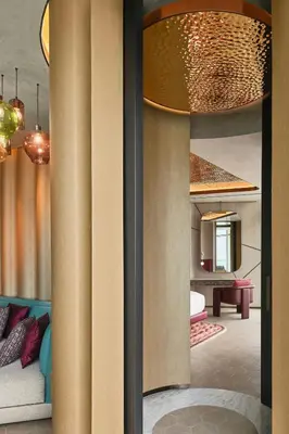 a living room with a couch and a table at W Dubai - Mina Seyahi in Dubai