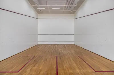an empty room with a wooden floor and white walls at Silkhaus comfy DIFC studio with Burj Khalifa view in Dubai