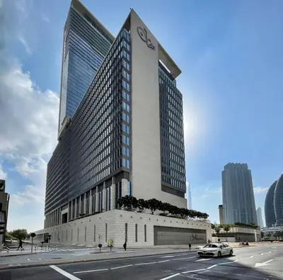 a tall building with a car parked in front of it at Silkhaus comfy DIFC studio with Burj Khalifa view in Dubai
