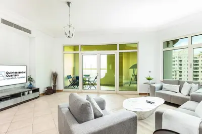 a living room with two couches and a tv at Dreamy and Spacious 3BR Unique Palm Jumeirah in Dubai