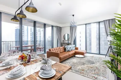 a living room with a couch and a table at Spacious & Full of light 3BR+ kids Dubai Mall in Dubai