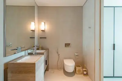 a bathroom with a sink and a toilet in it at 2 BDR Apt The Address Beach Resort JBR in Dubai