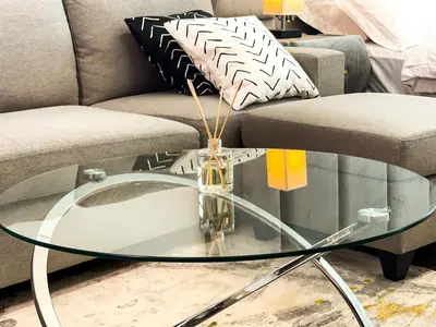 a glass coffee table in front of a couch at Luxury Studio Apartment Close to JBR Beach&Yacht Club&Metro-Available Airport Shuttle in Dubai