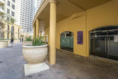 a large vase sitting outside of a building at HiGuests - Stylish Apartment in JBR Steps From the Beach in Dubai