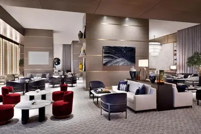 a hotel lobby with couches and chairs and tables at Emaar Residences in Dubai
