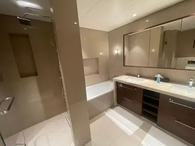 a bathroom with a shower and a sink and a tub at Burj Khalifa view, 3 Bedroom Apartment in Boulevard Point, Connected to Dubai Mall in Dubai