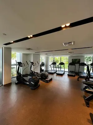 a gym with a bunch of exercise bikes in it at Burj Khalifa view, 3 Bedroom Apartment in Boulevard Point, Connected to Dubai Mall in Dubai