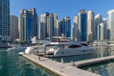 two boats are docked at a dock in a city at Frank Porter - Studio One in Dubai