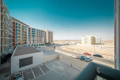 a view from a balcony of a building with a beach at Frank Porter - DAMAC Celestia in Dubai
