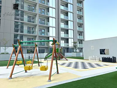 an empty playground in front of a building at Mira Holiday Homes - Newly Furnished 1 bedroom in Creek Vista Tower B Sobha Hartland in Dubai